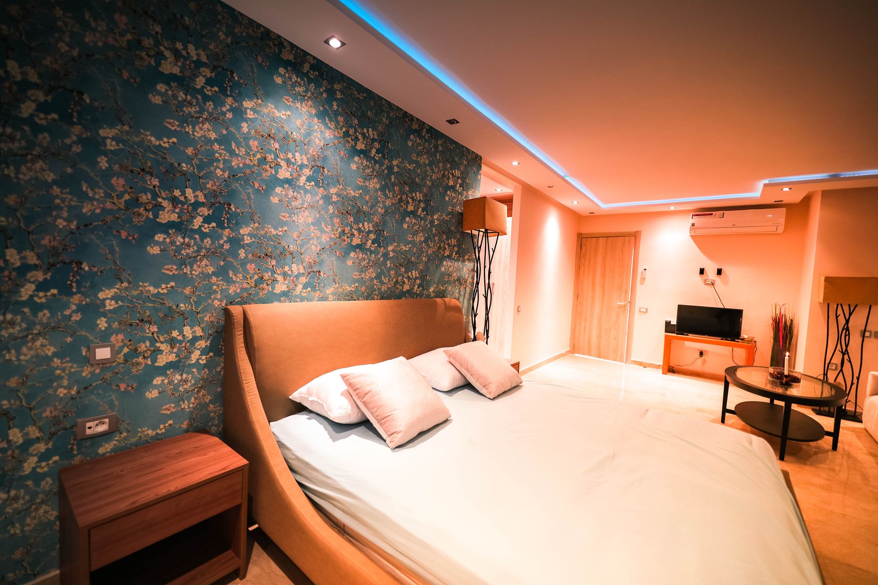 Floral wallpaper installed in a bedroom